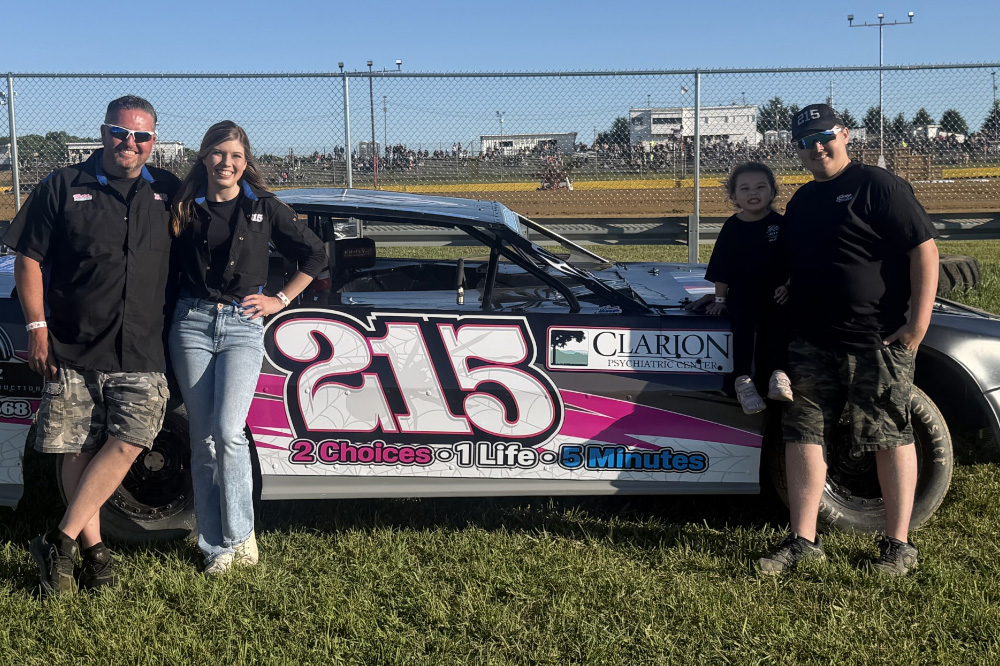 UOH Student Braxton Lee with his family and race car